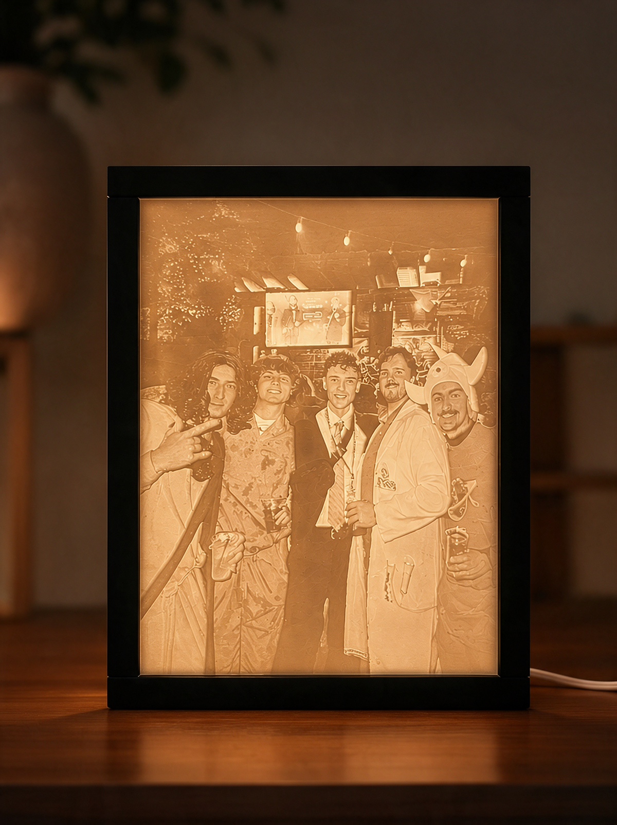 Personalized MemoryBox in the Tall size — a 16 × 12 cm glowing photo panel in a black frame