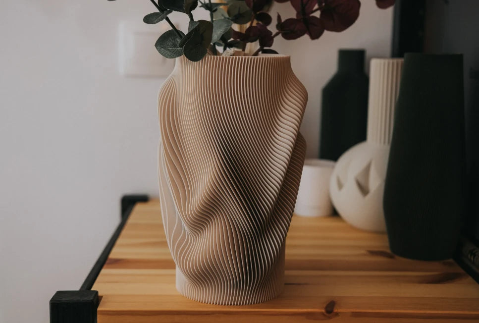 Terra Crest vase in Beige, styled on a wooden sideboard